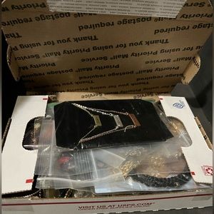 Assorted box of new and used jewelry